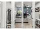 Stylish office with a modern desk, pendant lighting, and tiled floors, perfect for a home workspace at 18543 E Purple Sage Dr, Queen Creek, AZ 85142