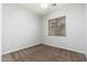 Bedroom with neutral walls, carpeted floors, and a window with blinds at 18575 E Pine Barrens Ave, Queen Creek, AZ 85142