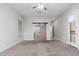 Bedroom featuring a barn door leading to an ensuite bathroom at 18575 E Pine Barrens Ave, Queen Creek, AZ 85142