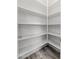 Walk-in pantry with white shelving providing ample storage space at 18575 E Pine Barrens Ave, Queen Creek, AZ 85142