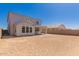 A large backyard with covered patio, awaits your landscaping ideas to complete the outdoor living space at 21830 E Bonanza E Ct, Queen Creek, AZ 85142