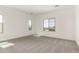 Spacious bedroom with carpet flooring and natural light from multiple windows at 21830 E Bonanza E Ct, Queen Creek, AZ 85142