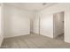 Bedroom with carpet flooring and multiple doors at 21830 E Bonanza E Ct, Queen Creek, AZ 85142