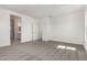 Large bedroom featuring neutral paint, carpet flooring, and access to the bathroom at 21830 E Bonanza E Ct, Queen Creek, AZ 85142