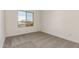 The standard bedroom has neutral carpet, white walls, and trim, plus a large window at 21830 E Bonanza E Ct, Queen Creek, AZ 85142