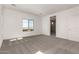 Well-lit bedroom with carpet flooring and a view of the community at 21830 E Bonanza E Ct, Queen Creek, AZ 85142