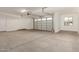 A spacious two car garage features a window for natural light at 21830 E Bonanza E Ct, Queen Creek, AZ 85142