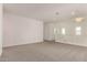Spacious room with neutral carpet, white walls, and modern design at 21830 E Bonanza E Ct, Queen Creek, AZ 85142