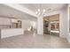 Open-concept living and dining area with tile floors, seamlessly connected to the kitchen at 21830 E Bonanza E Ct, Queen Creek, AZ 85142