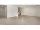 Open-concept living area with tile floors, featuring stairs to the upper level at 21830 E Bonanza E Ct, Queen Creek, AZ 85142