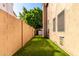 Spacious backyard featuring well-maintained artificial grass, perfect for outdoor activities and low maintenance living at 2226 E Beachcomber Dr, Gilbert, AZ 85234