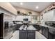 Modern kitchen featuring stainless steel appliances, granite countertops, and stylish cabinetry at 2226 E Beachcomber Dr, Gilbert, AZ 85234