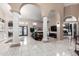 Expansive living room with tiled floors, decorative columns, and an open layout at 2226 E Beachcomber Dr, Gilbert, AZ 85234