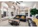 Spacious living room with plush seating, columns, and an open-concept layout at 2226 E Beachcomber Dr, Gilbert, AZ 85234