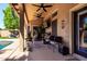 Covered patio featuring ceiling fans, comfortable seating and outdoor entertainment space at 2226 E Beachcomber Dr, Gilbert, AZ 85234