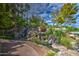 Scenic view of a cascading water feature with natural rocks and landscaping adding to the peaceful ambiance at 2226 E Beachcomber Dr, Gilbert, AZ 85234