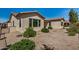 Low maintenance backyard with desert landscaping and ample space around the home at 240 N Monterey Ct, Casa Grande, AZ 85194