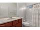 Cozy bathroom featuring a vanity with a sink, toilet, and a shower-tub combination with a curtain at 240 N Monterey Ct, Casa Grande, AZ 85194