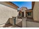 Inviting front entryway features a secure gated courtyard leading to the main entrance at 240 N Monterey Ct, Casa Grande, AZ 85194