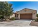 Charming single-story home featuring a spacious driveway, low-maintenance landscaping, and a welcoming facade at 240 N Monterey Ct, Casa Grande, AZ 85194