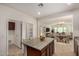Kitchen featuring an island with countertop seating, ideal for casual dining and entertaining at 240 N Monterey Ct, Casa Grande, AZ 85194