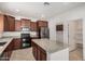 Well-equipped kitchen with stainless steel appliances, granite countertops, and plenty of cabinet space at 240 N Monterey Ct, Casa Grande, AZ 85194