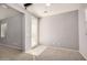 Spacious living room with tile entry, carpet, and glass patio door for natural light and access at 240 N Monterey Ct, Casa Grande, AZ 85194