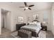 Serene main bedroom with neutral colors, ceiling fan, and a cozy atmosphere for relaxation at 240 N Monterey Ct, Casa Grande, AZ 85194