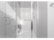 Accessible walk-in shower featuring a grab bar and seating; sleek and modern for convenience and safety at 240 N Monterey Ct, Casa Grande, AZ 85194