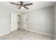 Bedroom features a ceiling fan, a closet and entrance door at 2698 E Carla Vista Dr, Gilbert, AZ 85295