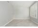 Cozy bedroom with clean white walls, tile floors, and a bright window with white shutters at 2698 E Carla Vista Dr, Gilbert, AZ 85295