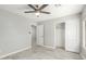 Bright bedroom with tile floors, closet and ceiling fan at 2698 E Carla Vista Dr, Gilbert, AZ 85295