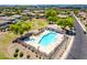 Aerial view of a community pool with spa, lounge chairs, and shade ramada at 2698 E Carla Vista Dr, Gilbert, AZ 85295