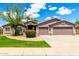 Attractive single-story home with a lush front lawn and a three-car garage on a sunny day at 2698 E Carla Vista Dr, Gilbert, AZ 85295