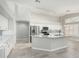 Kitchen with an island, white cabinets, stainless steel appliances, and marble countertops at 2698 E Carla Vista Dr, Gilbert, AZ 85295