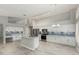 Well-lit kitchen with an island, stainless steel appliances, white cabinets, and mosaic backsplash at 2698 E Carla Vista Dr, Gilbert, AZ 85295