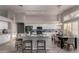 Modern kitchen with white cabinets, stainless steel appliances, and an island with bar seating at 2698 E Carla Vista Dr, Gilbert, AZ 85295