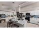 Spacious kitchen featuring a large island, white cabinets, stainless steel appliances, and breakfast bar at 2698 E Carla Vista Dr, Gilbert, AZ 85295