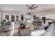 Open floor plan with an eat-in kitchen, granite counters, island seating, and a spacious living room at 2698 E Carla Vista Dr, Gilbert, AZ 85295