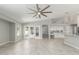 Open living space featuring tile floors and connecting to the kitchen with an island at 2698 E Carla Vista Dr, Gilbert, AZ 85295