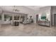 Airy living room with modern decor, large windows, and a comfortable seating area at 2698 E Carla Vista Dr, Gilbert, AZ 85295