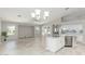 Open floorplan view of the living room and kitchen, with tile floors and natural light at 2698 E Carla Vista Dr, Gilbert, AZ 85295