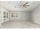 Open living area with tile floors, plantation shutters, ceiling fan and French doors to bring the outside in at 2698 E Carla Vista Dr, Gilbert, AZ 85295