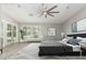 Tranquil main bedroom featuring neutral walls, a ceiling fan, and access to the outdoor space through French doors at 2698 E Carla Vista Dr, Gilbert, AZ 85295