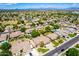Aerial view of homes with lush landscaping and mature trees at 2698 E Carla Vista Dr, Gilbert, AZ 85295
