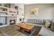 Cozy living room featuring a stone fireplace, comfortable seating, and warm lighting at 2727 S Sawyer Cir, Mesa, AZ 85209