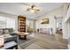 Spacious living room with a vaulted ceiling, wood flooring, and a large sectional sofa at 2727 S Sawyer Cir, Mesa, AZ 85209
