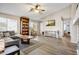 Spacious living room with a vaulted ceiling, wood flooring, and a large sectional sofa at 2727 S Sawyer Cir, Mesa, AZ 85209