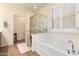 A large soaking tub and walk-in shower can be found in this bathroom at 289 W Ironhorse Ln, San Tan Valley, AZ 85143