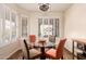 Cozy dining area with a glass table, shuttered windows, and ceiling fan at 289 W Ironhorse Ln, San Tan Valley, AZ 85143